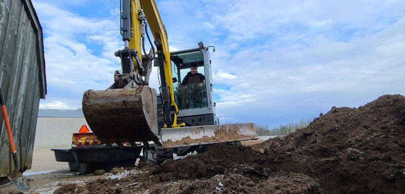 Mini excavator working on a residential site